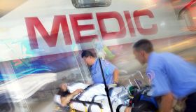 Paramedics loading patient into ambulance