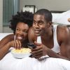 African American Couple Watching a Movie at Home