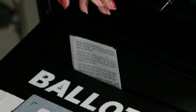 (Los Angeles)Precinct workers drop ballots into the ballot box at the PicoAliso Social Hall polli