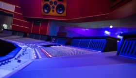 Mixing Audio Control Panel, High Power Speakers And View Through Soundproof Window On Musicians
