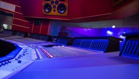 Mixing Audio Control Panel, High Power Speakers And View Through Soundproof Window On Musicians